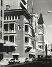 Left side elevation of town hall clock with Lands & Surveys Department building