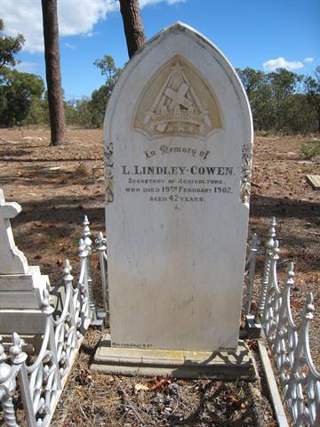Headstone and cast iron surround of L Lindley-Cowen