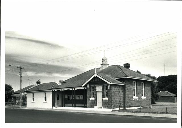 Front corner elevation showing Court House entry and signage