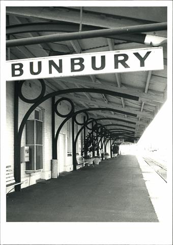 Detail of the station platform showing signage and rails