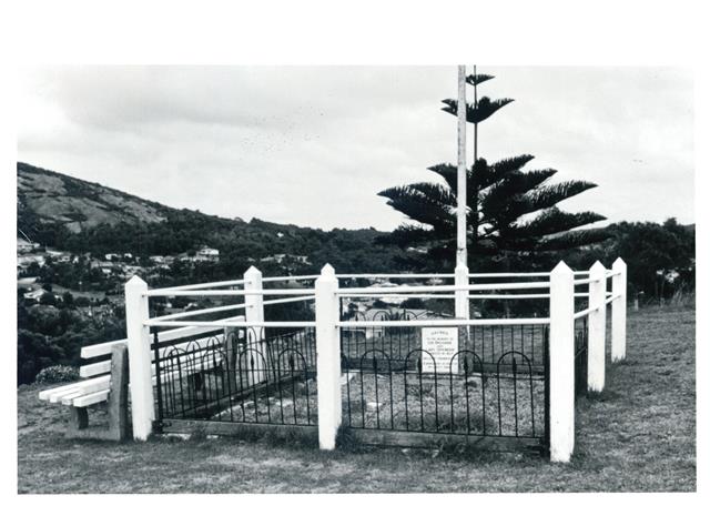 Near corner elevation of grave showing plaque
