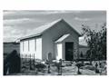 Front entry view of the church, recently rendered, showing some graveyard in for