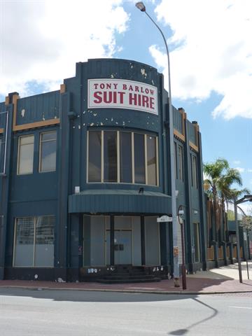 Corner facade showing modified doors-windows