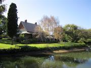 View of houses across lake to south