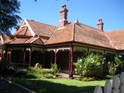 View looking south of Number 34 verandah in garden setting