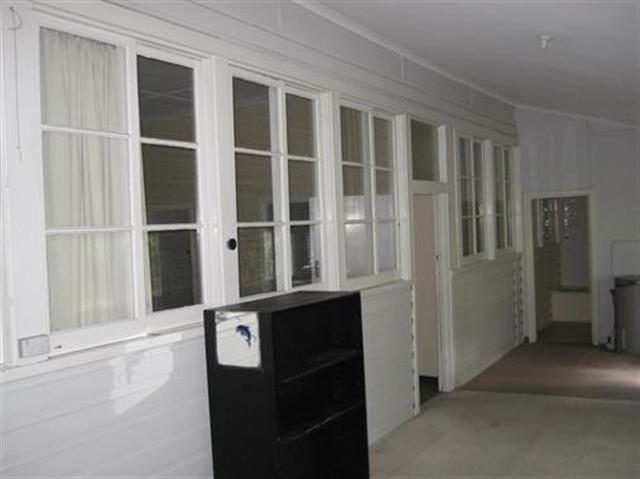 Former hospital - Unit 1 original timber framed windows and cladding