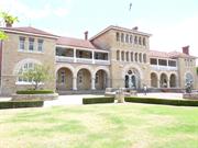 Front View showing surrounding grassy area