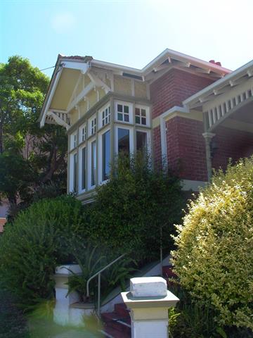 Detail of South-West bay with bay window and entry steos to verandah