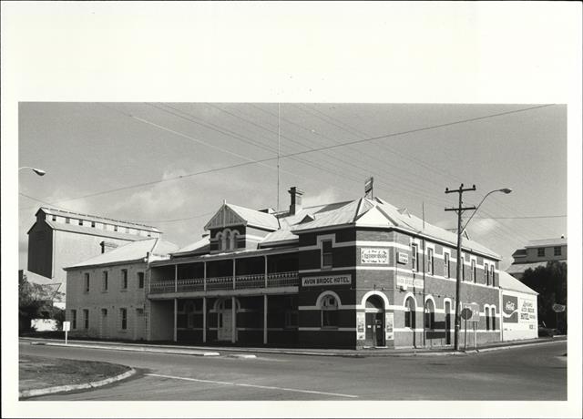 Contextual front corner elevation of building