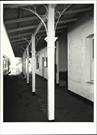 View along platform showing deatil of verandah posts and ironwork