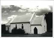 Front corner elevation, church bell visible on the side of the building