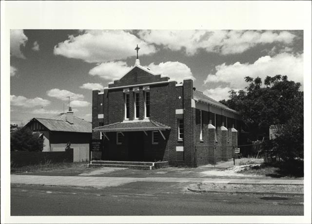 Angled front elevation of church from Angelo Street
