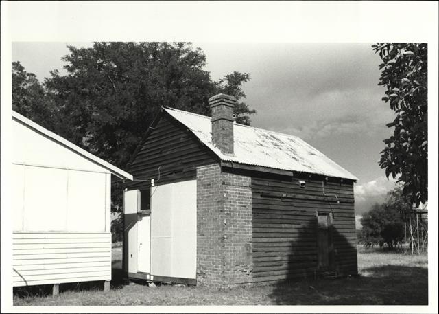 Corner elevation of original building with later building shown adjacent