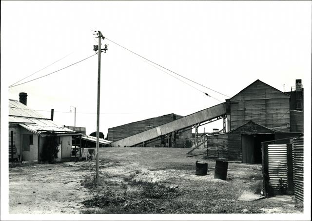 View across the site, office on the left, conveyor in the background