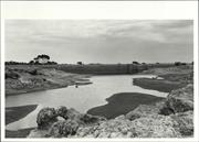 Distance view of dam showing picnic for scale