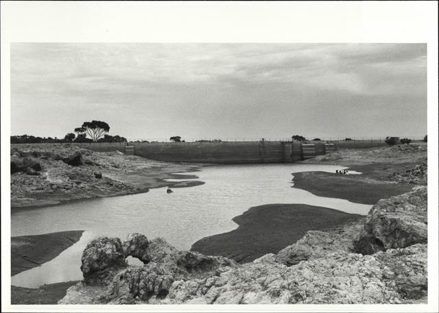 Distance view of dam showing picnic for scale