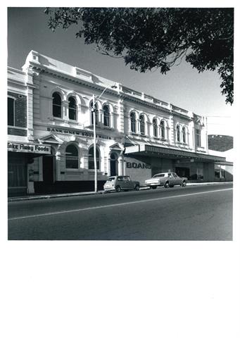 Corner elevation showing full building facade