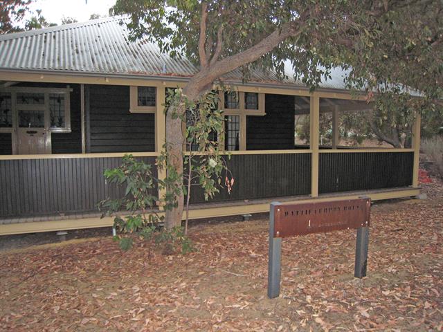 Side view showing verandah and stained glass windows