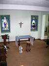 Interior of east wall of the Memorial Chapel showing stained glass windows of th