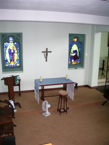Interior of east wall of the Memorial Chapel showing stained glass windows of th