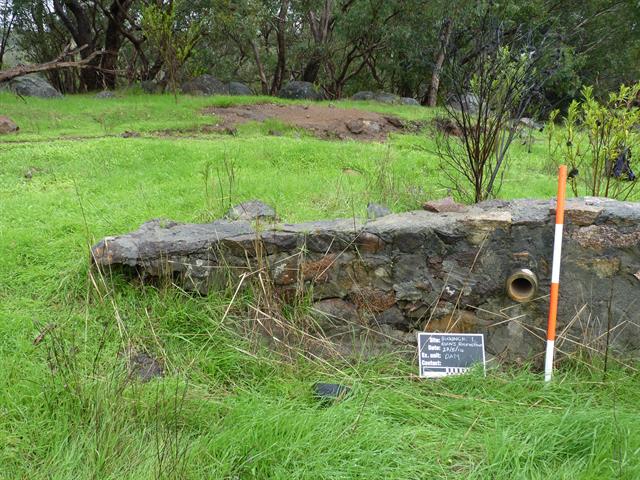 Stone dam, interior with pipe - view west