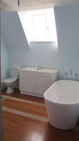 Interior upstairs bathroom in fmr attic