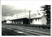 Corner elevation of the station platform with rail in foreground