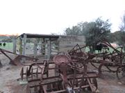 outbuilding and machinery to south of cottage