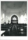 Interior portrait view with ceiling visible