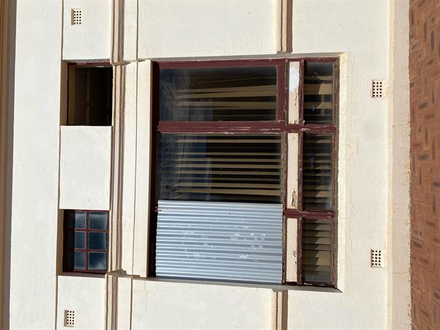 Large window boarded up, photo courtesy Aimee Monaghan