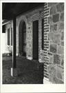 View of part of hotel frontage under verandah showing detail of masonry