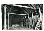 Interior view of barn showing ceiling beams, rafters & purlines