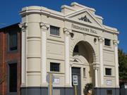 Front elevation showing plain brick to side