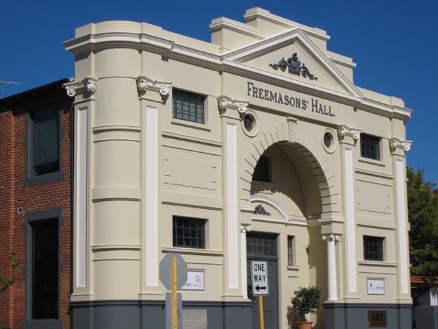 Front elevation showing plain brick to side