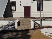 Concrete steps and verandah to north facade