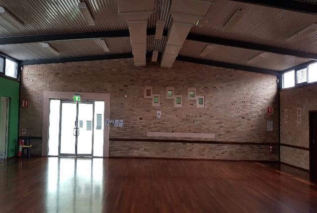 Interior looking West at Cinema projection holes in the wall