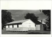Corner elevation of later building showing original building in background