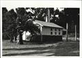 Corner elevation of building (partially obscured)