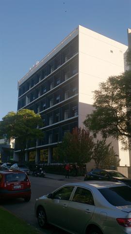 Front of building, view across Delhi St