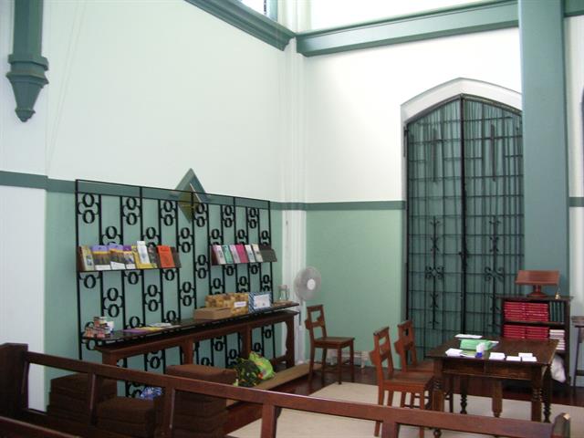 Interior south west of nave showing wrought iron baptistery screen and door