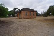 School building in setting showing south elevation