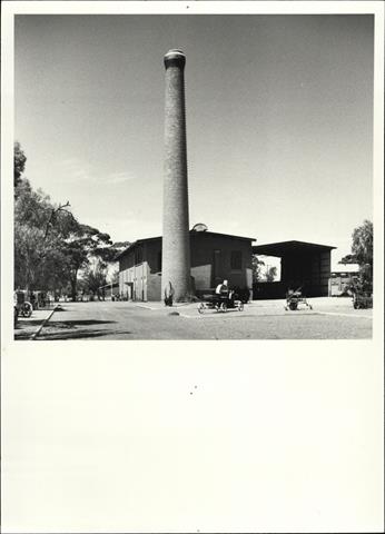 Side elevation of the entire building including the full height of the chimney