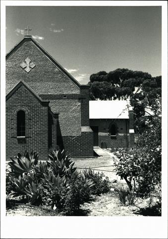 Front view of church showing exterior of transept