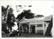 Front elevation of older part of building showing waterfront in background