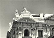 View of top corner of building showing detail of cornice