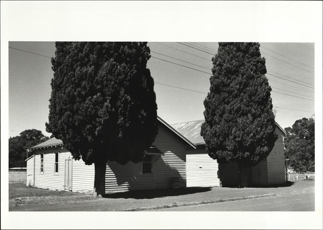 Left corner elevation of supper room showing town hall on the right