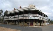 Front facade showing corner entry and verandahs