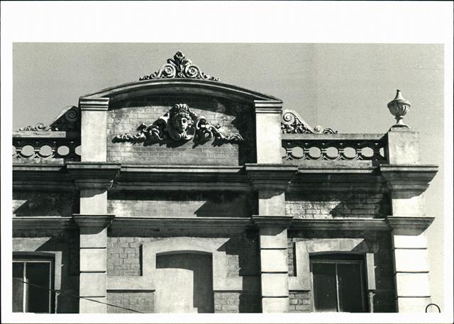 Detail of pediment on left hand building