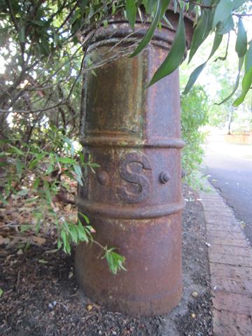 Detail; cast iron base, lettering and access panel