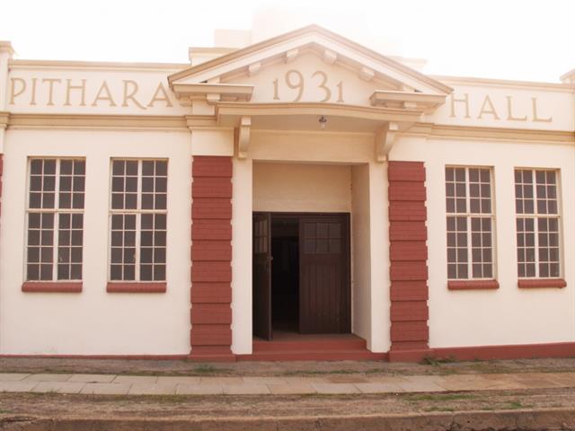 Hall facade showing portico, name and date of construction